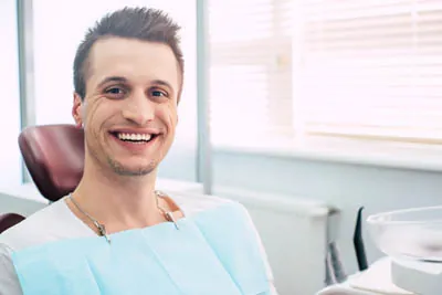 man showing off his smile after getting dental veneers at Dynamic Dental in Louisville, KY